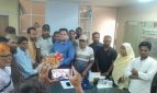 যাকে পুলিশ খুঁজছে তিনি ফুল দিচ্ছেন ইউএনওকে
